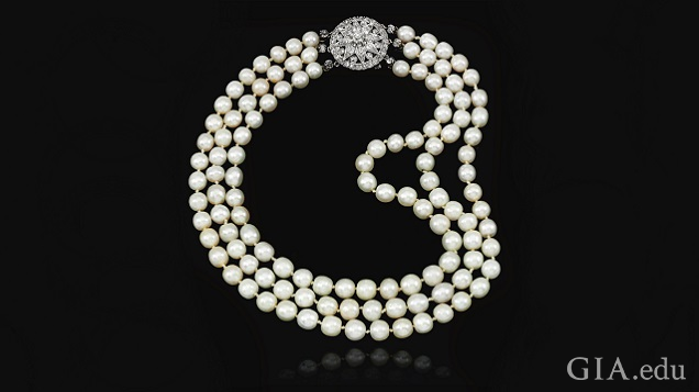 Three strands of pearls with a diamond clasp. Three strands of pearls with a diamond clasp.